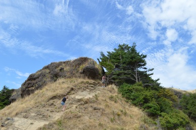 Scaling a cliff near Helliwell Provincial Park!